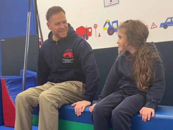 Stuart Brown Occupational Therapist, with a young person he is helping