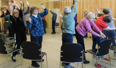 Senior Center members participating in an exercise class