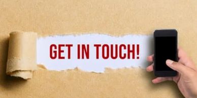 Hand holding phone with 'GET IN TOUCH!' message.