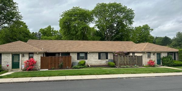 Roofing professionals fixing a residential roof in Macungie, PA.
