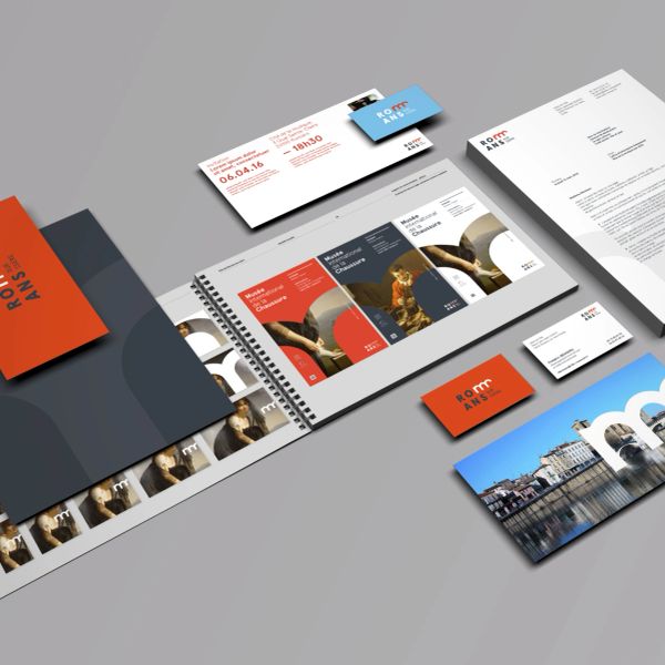 Modern branding materials including brochures, business cards, and letterhead with a clean, professional design.