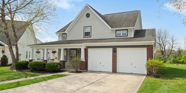 Two-story suburban house with a double garage.