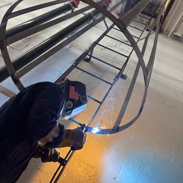 Welder fabricating and repairing custom metal structures using welding techniques.