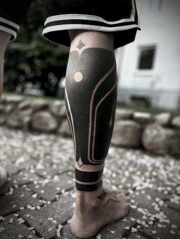 Blackout leg tattoo by Pierre marcel tattoos, Munich, Germany. Bali