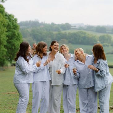 Six women in pajamas enjoying outdoors.