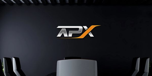 Modern conference room with APX logo on black wall.