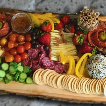 Meats, cheeses, vegetables, crackers, breads, jams, spreads, fruits, nuts, delicious!