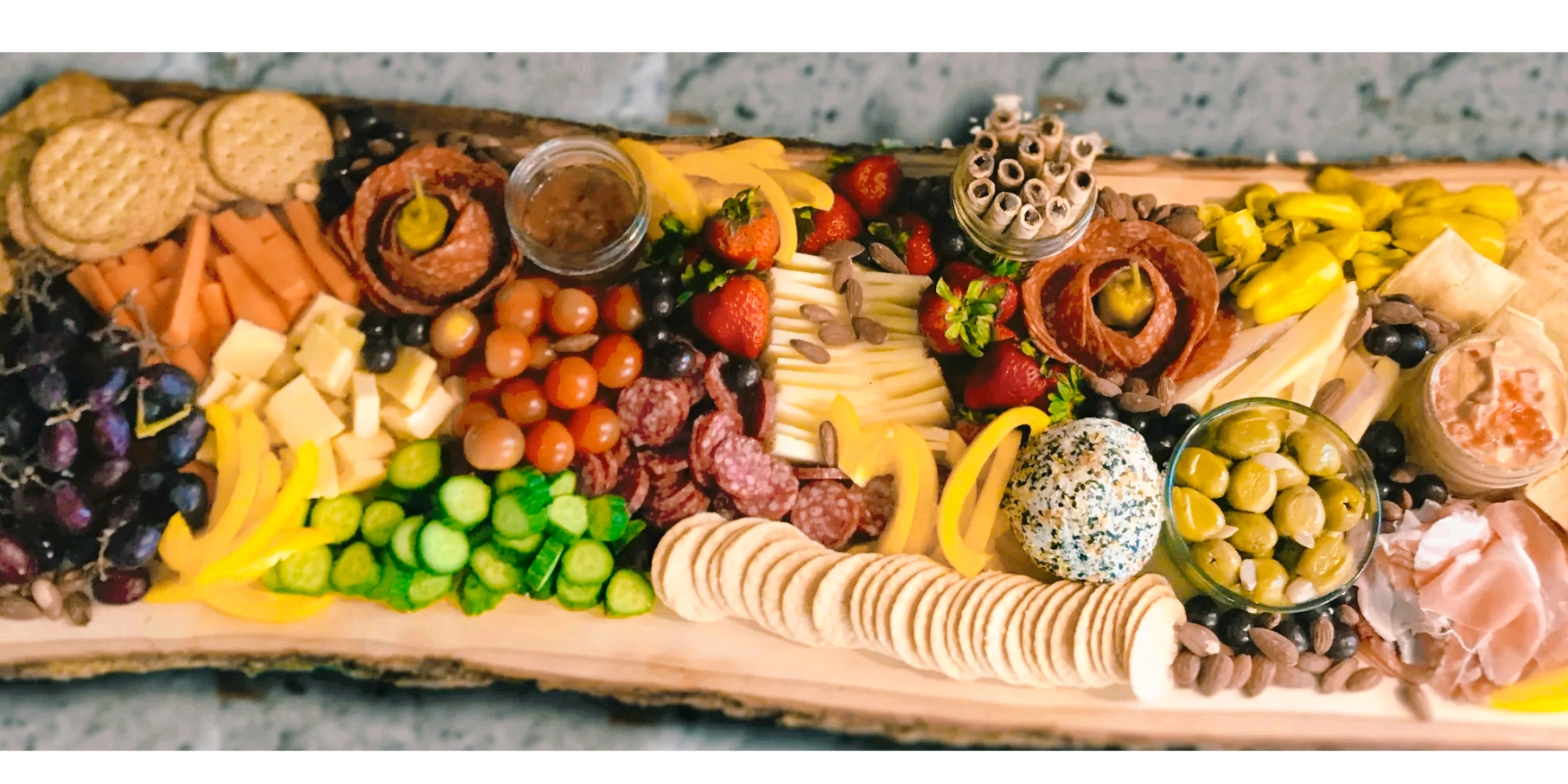 Large grazing charcuterie on raw wood for wedding/ graduation. Assorted goodies for 100 @ $10/person