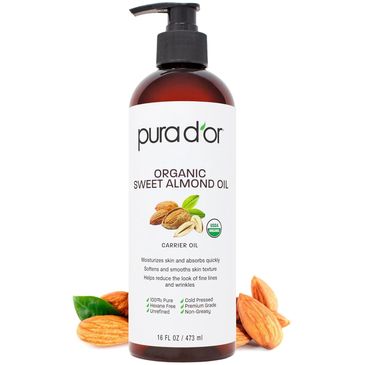 Bottle of Pura d'or Organic Sweet Almond Oil with almonds.