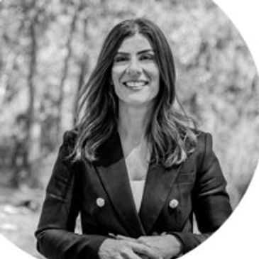 Dr. Anna Finizio Wearing black suit with looking on the camera