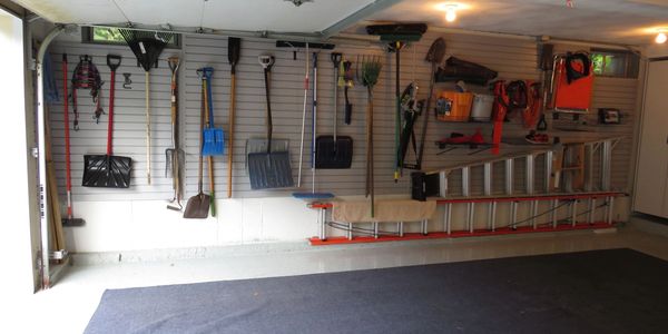 Garage wall storage using slatwall panels & accessories.