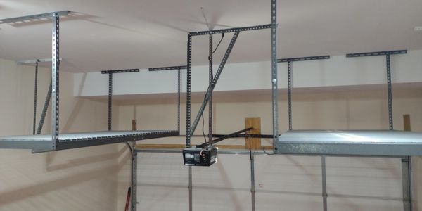 2 ceiling mounted stationary ceiling storage platforms.
600 lbs. capacity, 4' width , 8' length.
