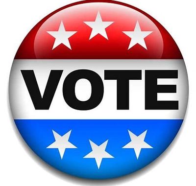 Round button with red, white, and blue colors and the word 'VOTE' with stars.