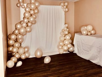 Photo White Sheet backdrop with pearl balloon bouquets attached. Photo Memories for your event
