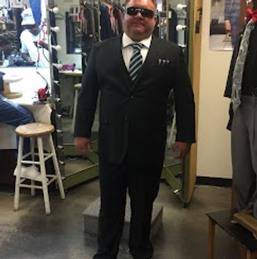 Man in his tailored suit black slim fit