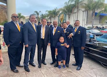 Club in matching navy suits