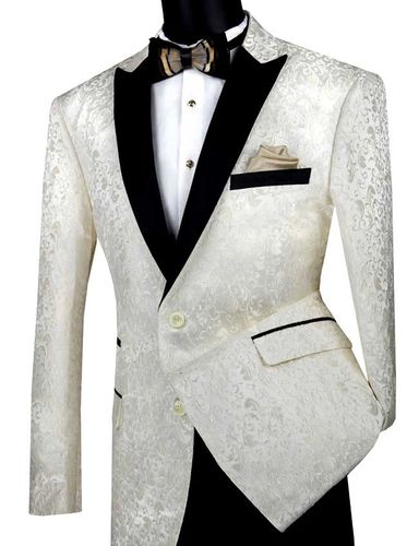 Champagne, ivory tuxedo with black peak lapels and black pants, white shirt, black and gold bow tie.