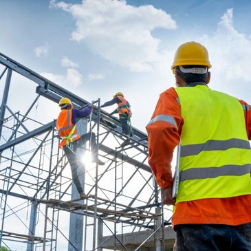 Engineer Technician Overlooking Team Of Workers On High Steel Platform, 