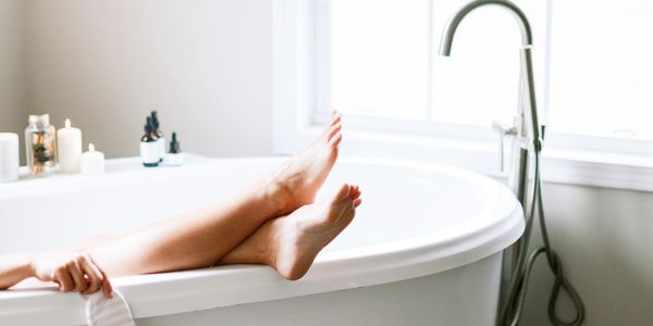 woman relaxing in bath - free self care workbook link