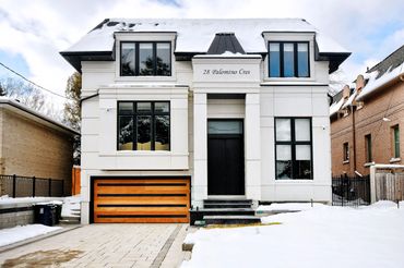 A beautifully crafted custom home in North York, showcasing elegant architecture, a striking kitchen