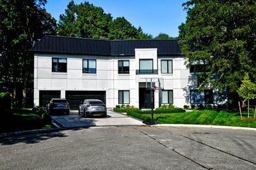 8 Elspeth Place offers modern luxury with a striking exterior, high ceilings, a floating glass stair