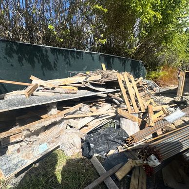 Construction debris removal in Miami including wood framing, plywood, rebar, and mixed 