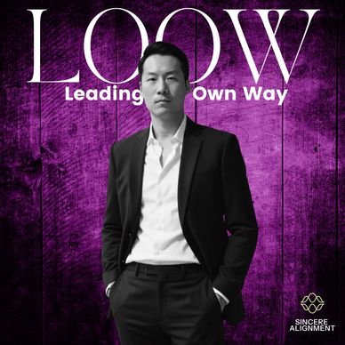 Confident man in a black suit on a purple textured background with the text 'Leading Own Way'.