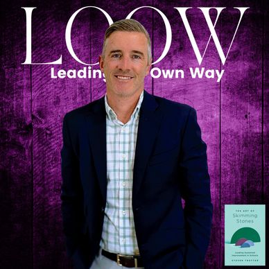 Confident man in blazer posing for LOOW magazine cover.
