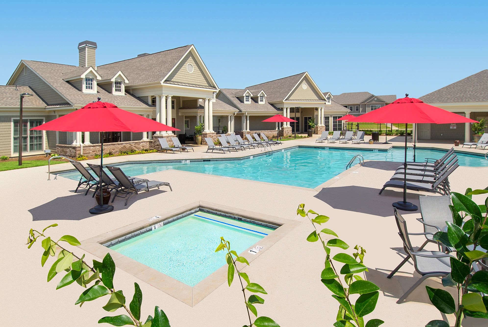 Resort-style swimming pool and clubhouse at Greystone at Oakland apartments in Leesburg, GA.
