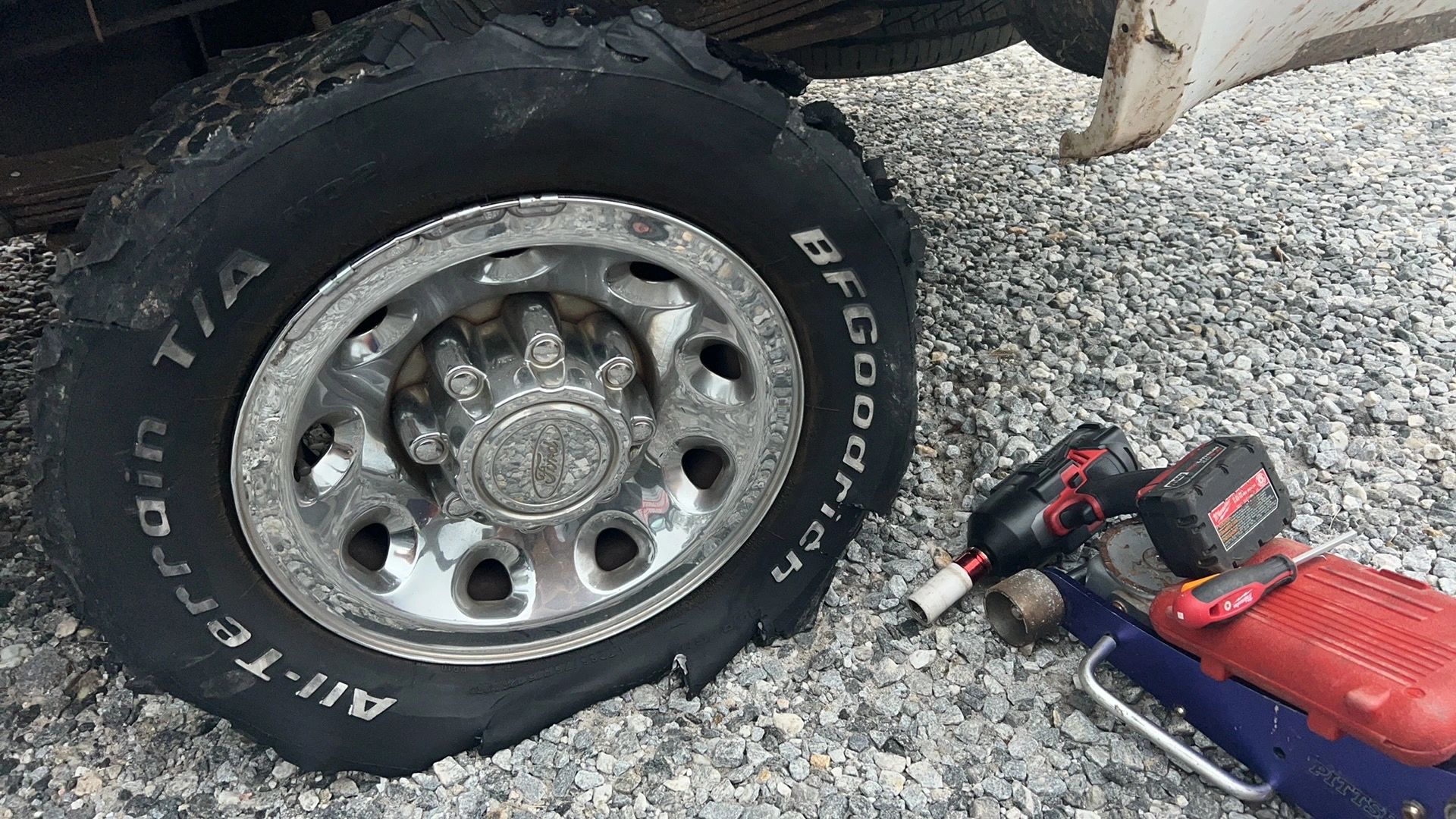 Damaged tire and wheel during mobile tire replacement service by Roadside Now 24/7 serving Dahlonega