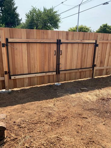 Overlap double drive gates back view Portland Oregon cedar fence and gate installation 