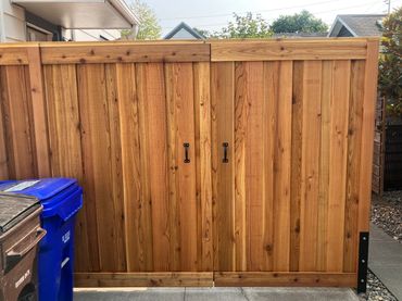 Overlap picture frame style double driveway gates 
Portland Oregon cedar fence and gate installation 
