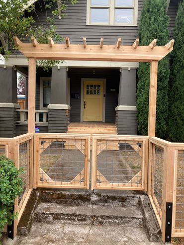 Arbor over utility panel  style double entry gates 
Portland Oregon cedar fence installation 