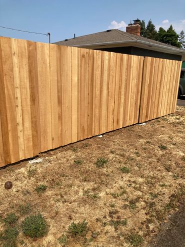 Front view overlap style double drive gates Portland Oregon cedar fence and gate installation 