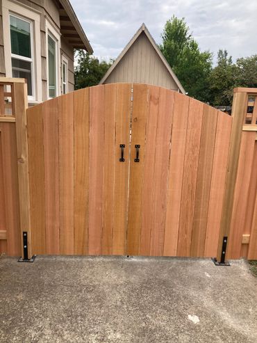 Solid style round top double drive gates front view 