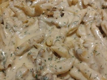 Pasta in creamy sauce with herbs.