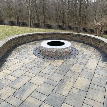 Paver patio installation with firepit and a sitting wall in Prospect, Kentucky 
