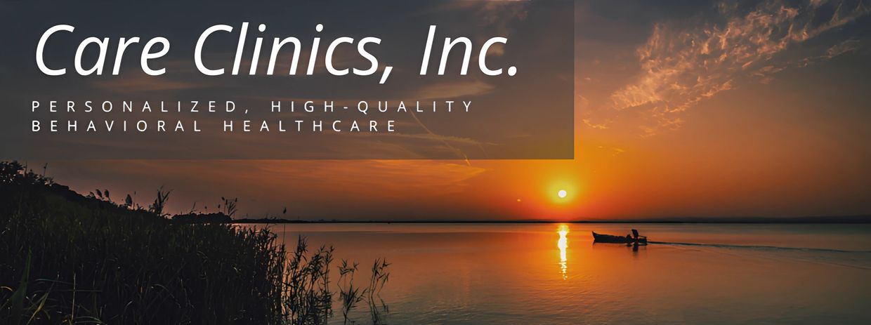 Sunset with boat on water and clinic advertisement.