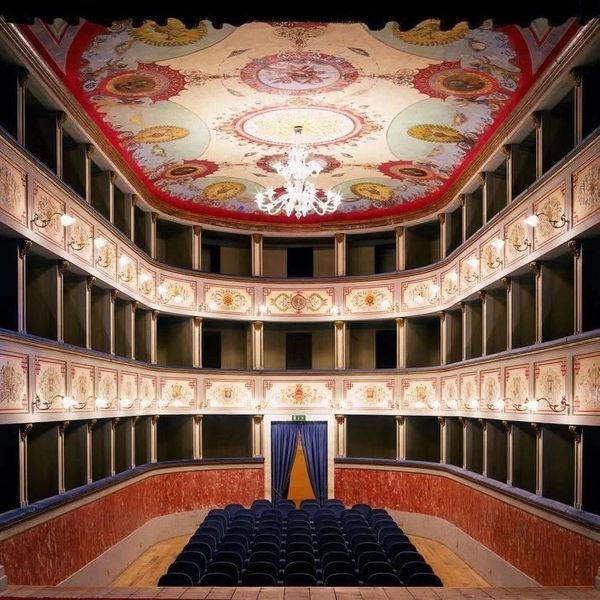 Ornately decorated Italian opera theater.