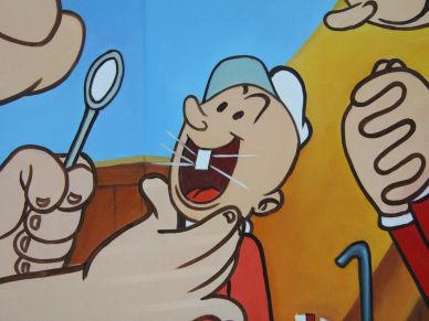 Cartoon character with a dental mirror and dentist hands.