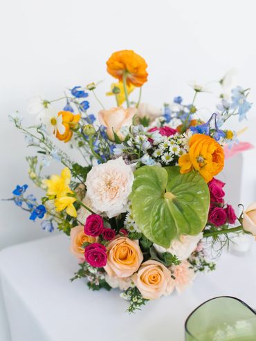wedding Colorful centerpiece welcome table  delphinium anthurium San Francisco, CA Fort Mason Center