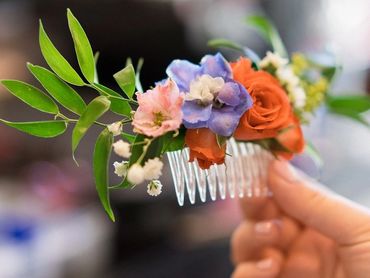 A colorful custom floral hair pin for a beautiful bride at Picchetti Winery in Cupertino, CA