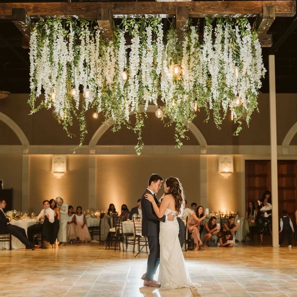 Hanging arbor at Casa Real at Ruby Hill Winery, Grand floral installation white wisteria first dance