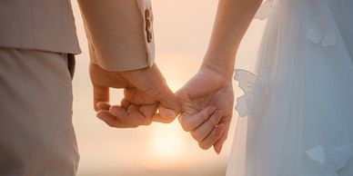 Couple holding hands wedding