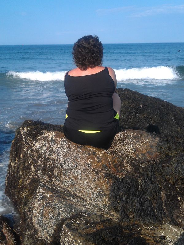 The author is sitting on a rock, anchored to where God placed her and abiding
