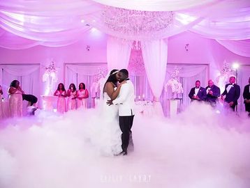 Bride and Groom dancing on the clouds
