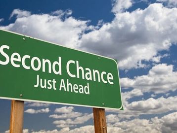 Second Chance written on what appears to be a highway sign. 