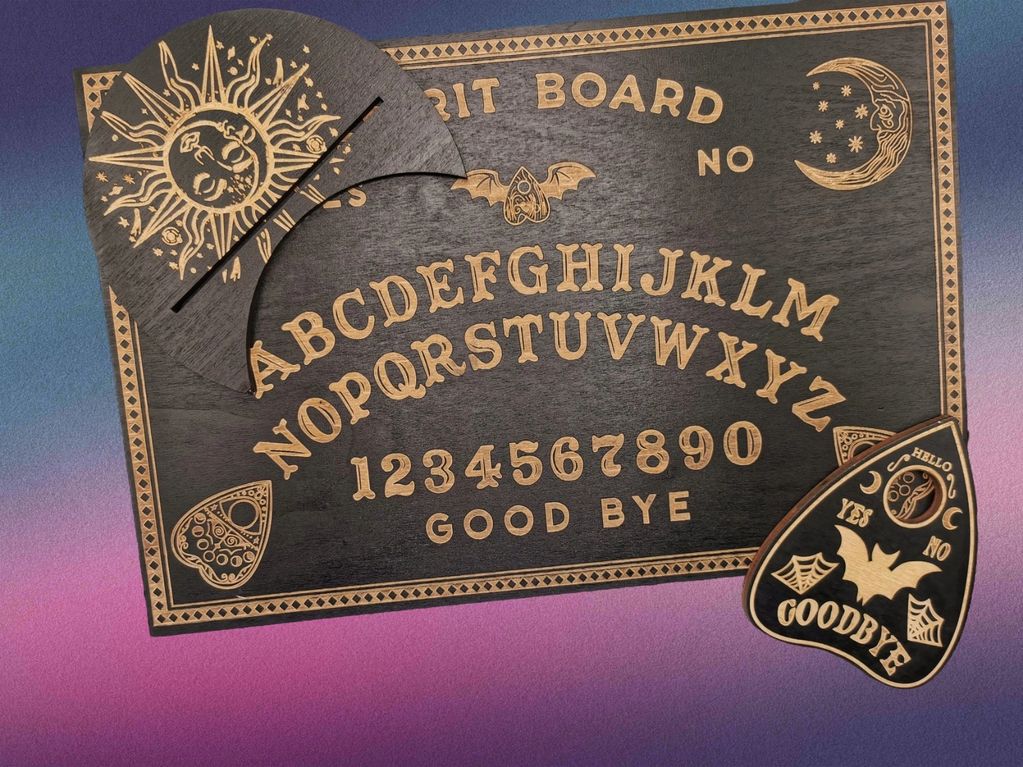 A decorative wooden spirit board with alphabet and numbers.