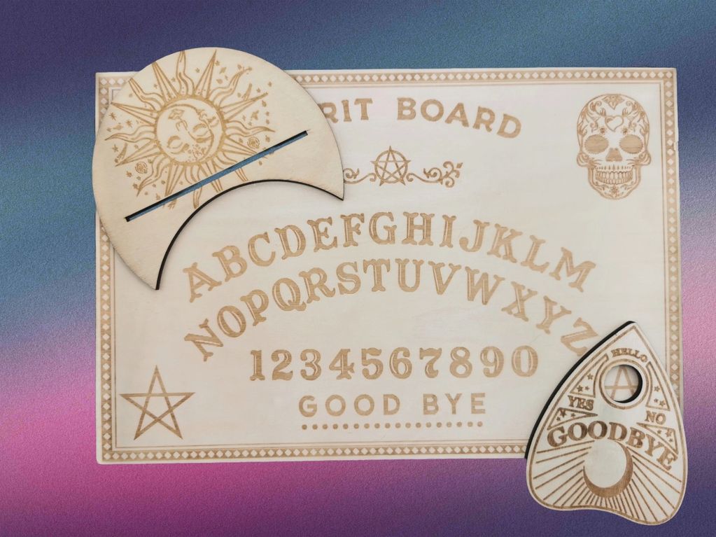 Wooden spirit board with sun design planchette.
