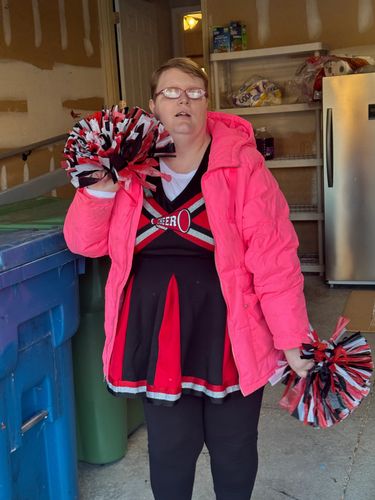 Gearing up to hand out candy at Halloween! Jess in her cheer costume. 